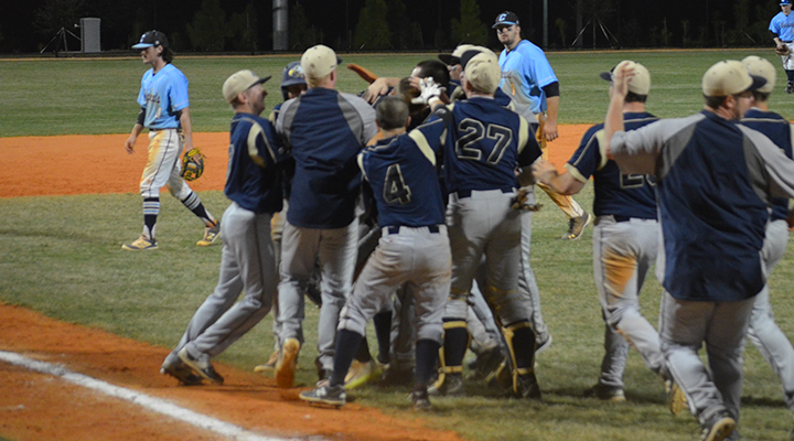 The Eagles surround Devyn Carper after his game-winning hit.