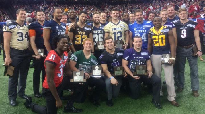 Juniata QB Ward Udinski poses with fellow members of the Allstate/AFCA Goodworks Team at halftime of the Sugar Bowl.
