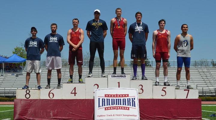 Tyler Mandley stands on the podium after his second place finish in the 110 meter hurdles at the Landmark Championships