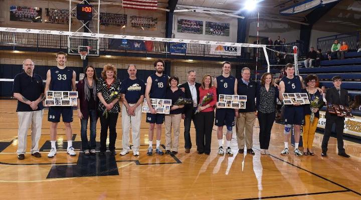 The 2015 men's volleyball seniors pose with their parents before the Hilbert match.