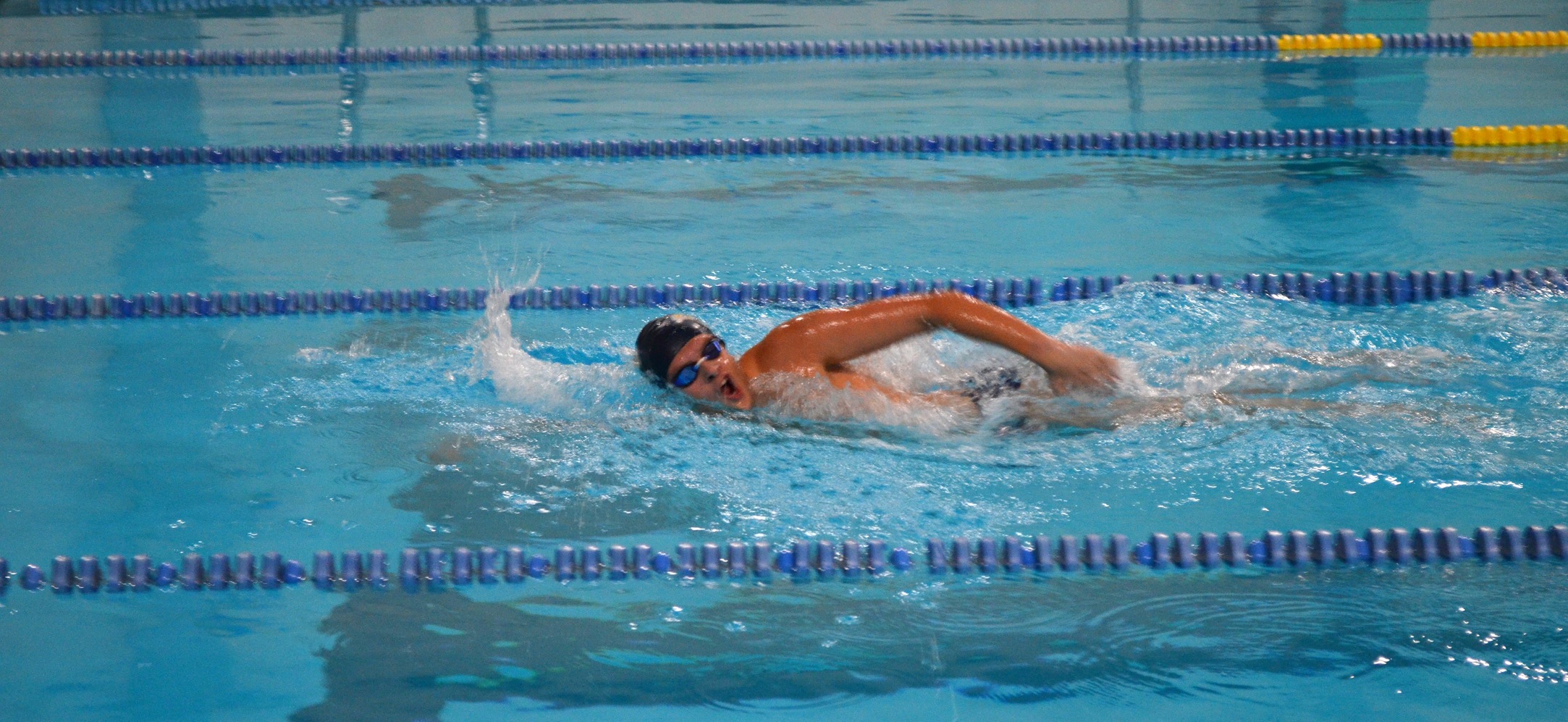 Mona Breaks Two Pool Records, but Eagles Fall to Goucher and Scranton