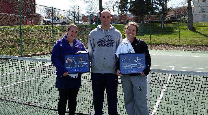 Seniors Heather Waring and Cara Stough show off their senior gifts with head coach Jason Cohen.