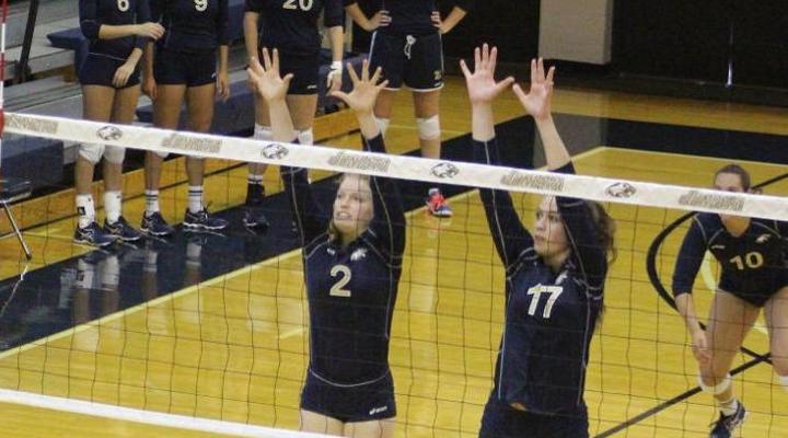 Kelly Reynolds and Megan Moroney going up for a block during the Blue-Gold Scrimmage Sat. Aug. 29.